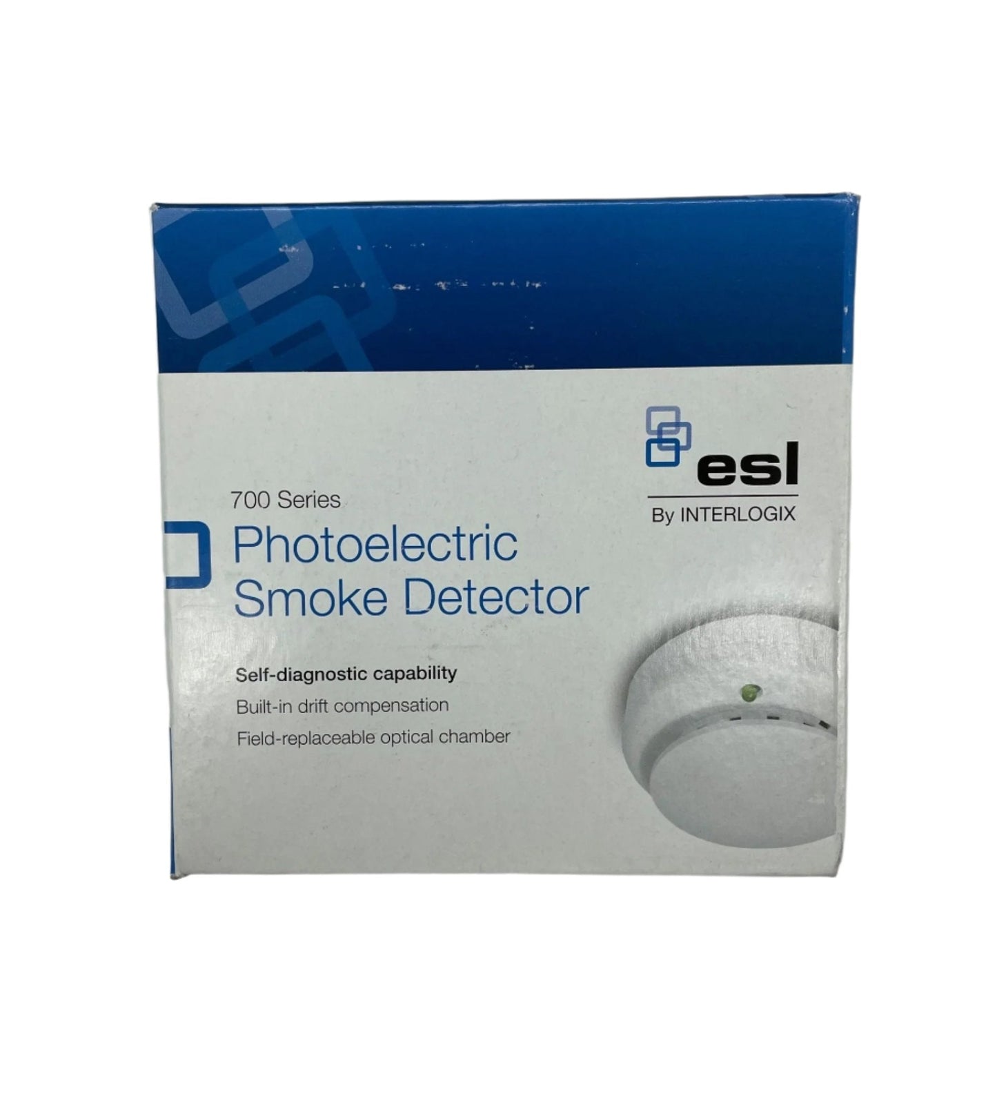 Edwards 721UT smoke detector mounted on ceiling, featuring a round white design with sensor and test button for home safety.