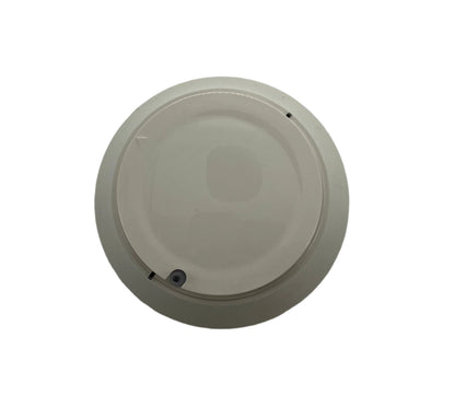 Farenhyt IDP-FIRE-CO-IV fire and carbon monoxide detector mounted on ceiling, showcasing its compact design and alert indicator lights.