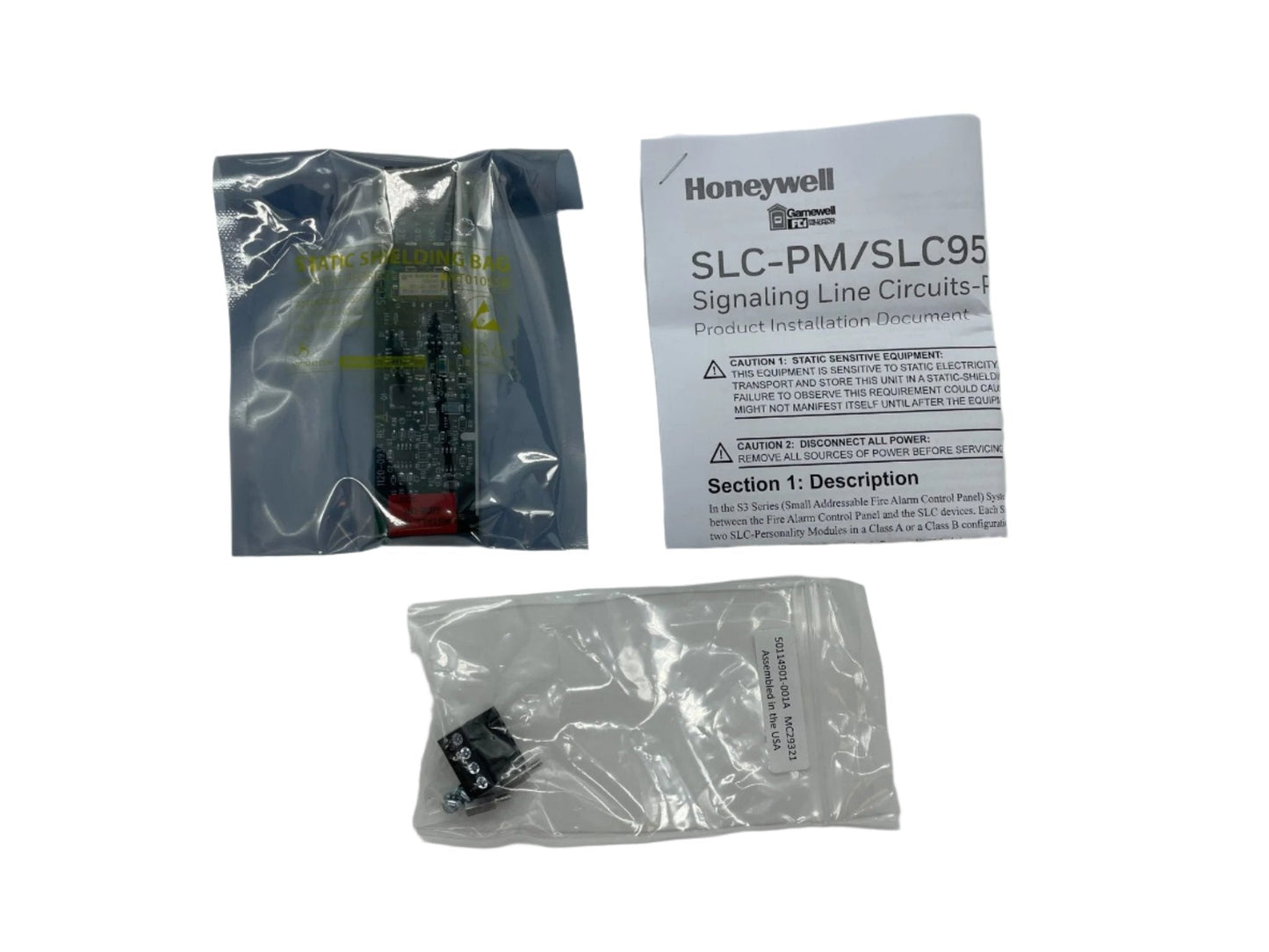 Gamewell-FCI SLC-PM control module for fire alarm systems, shown as a compact, black device with connection ports.