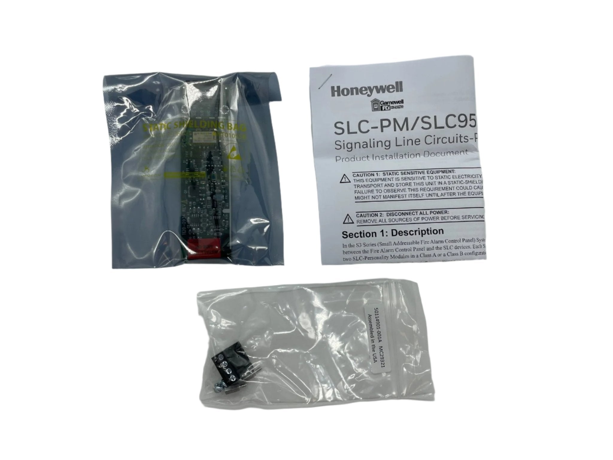 Gamewell-FCI SLC-PM control module for fire alarm systems, shown as a compact, black device with connection ports.