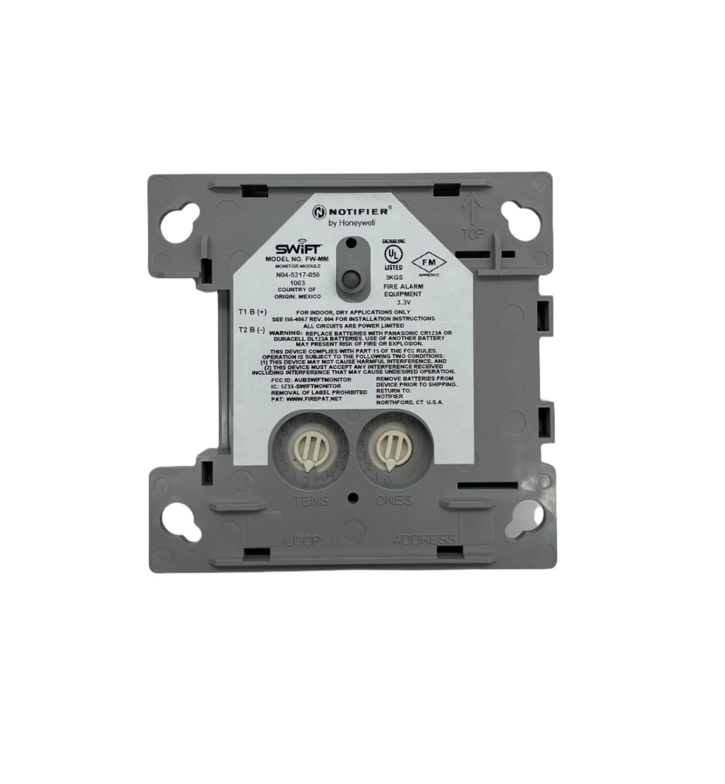 Notifier FW-MM wireless addressable monitor module for fire alarm systems, shown with connection ports and LED indicators.