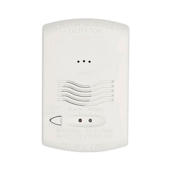 System Sensor CO1224T carbon monoxide detector with digital display, mounted on wall, showing alert indicators and test button.